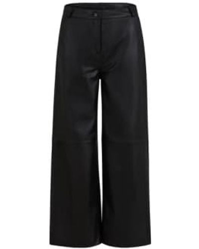 COSTER COPENHAGEN Pantalon cheville en cuir noir