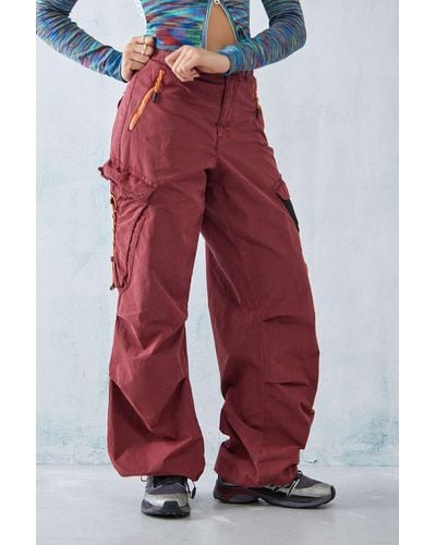 ASOS DESIGN tapered leather look cargo pants in burgundy