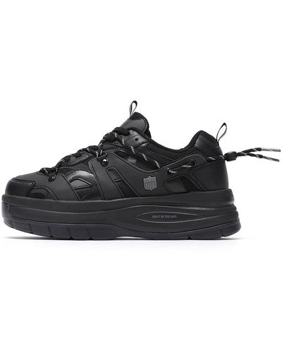 Black Nfl Sneakers for Men | Lyst