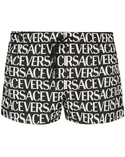 Versace Short de bain à logo imprimé - Noir