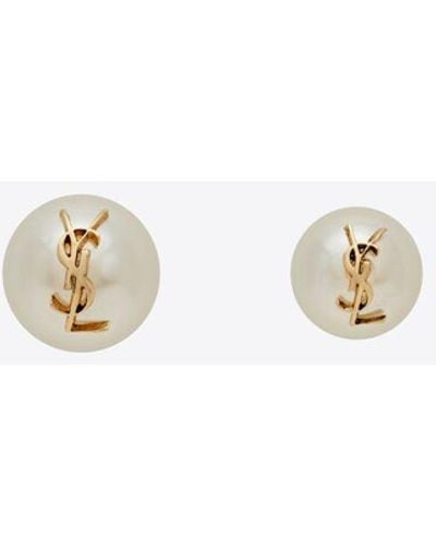 Saint Laurent Paar asymmetrischer ohrringe, bestehend aus einer kleinen nd einer großen perle mit dem cassandre. gelb/gold - Mettallic