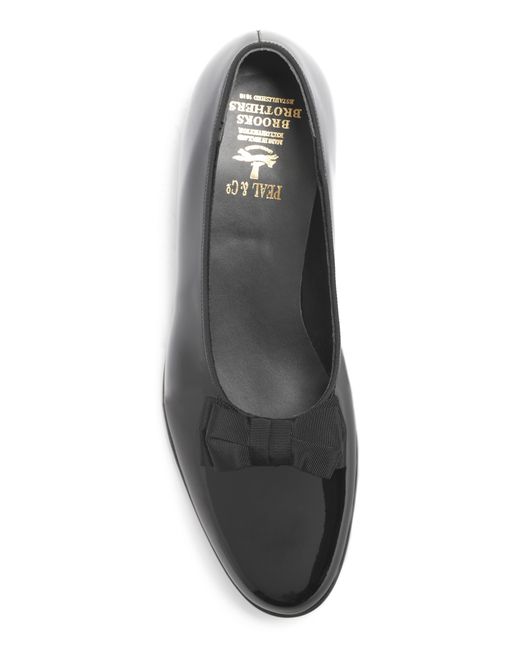 black patent loafers with bow
