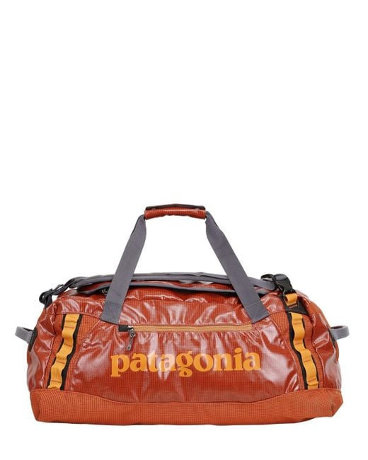 Patagonia Orange Black Hole Duffle Bag for men