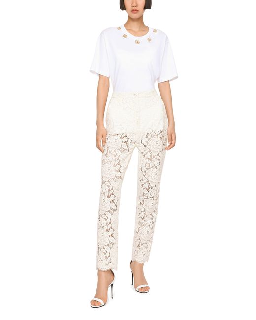 Pantalon en dentelle stretch à logo Dolce & Gabbana en coloris White