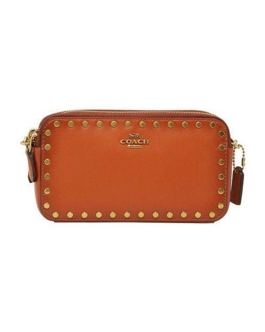 Coach crossbody clutch with rivets best sale