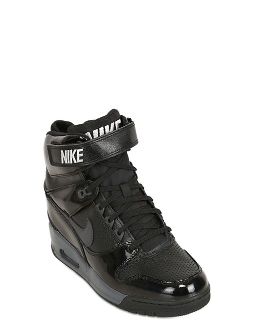 bisonte hielo Monumento Nike Air Revolution Sky High Top Sneakers in Black | Lyst UK