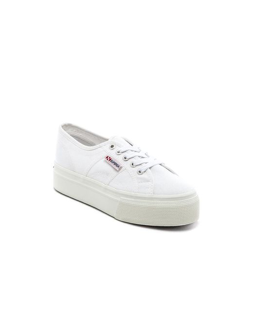 white lace up canvas sneakers