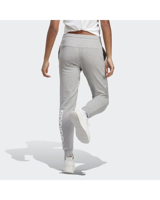 Pantaloni Essentials Linear French Terry Cuffed di Adidas in White