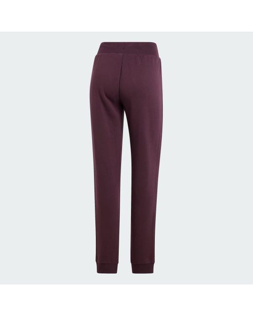 Pantaloni Adicolor Essentials Fleece Slim Joggers di Adidas in Red