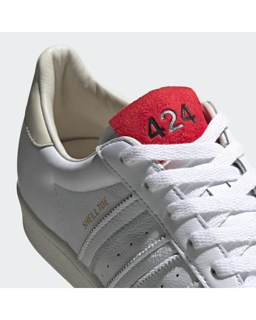white adidas shell toe shoes