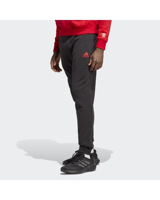 Pantaloni Chinese Story Manchester United FC di Adidas in Black da Uomo
