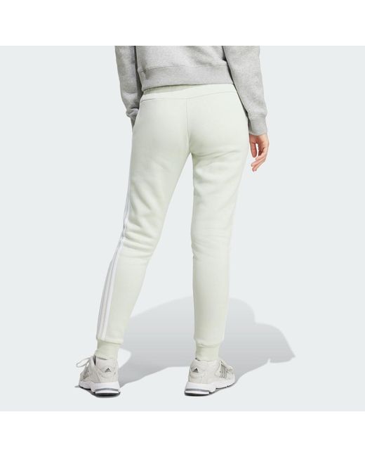 Pantaloni Essentials 3-Stripes Fleece di Adidas in White