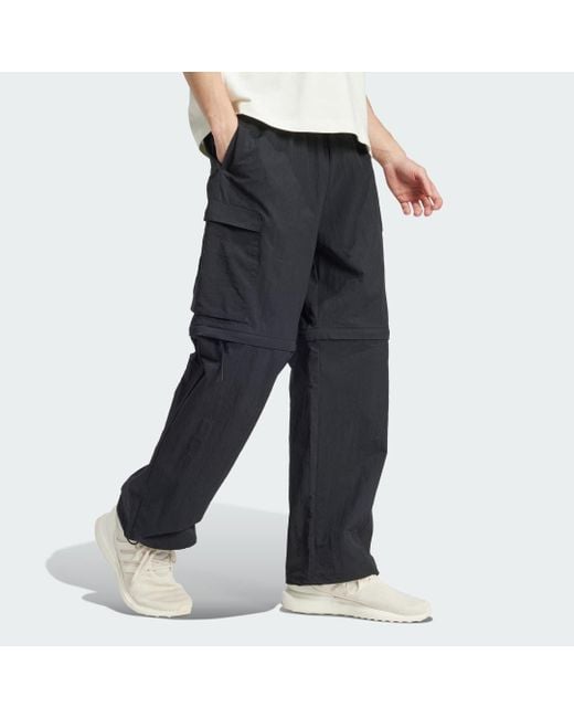 Adidas tracksuit bottoms with zip legs hotsell