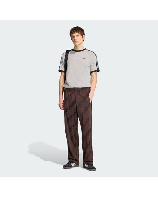 Adidas Brown Monogram Firebird Track Pants for men