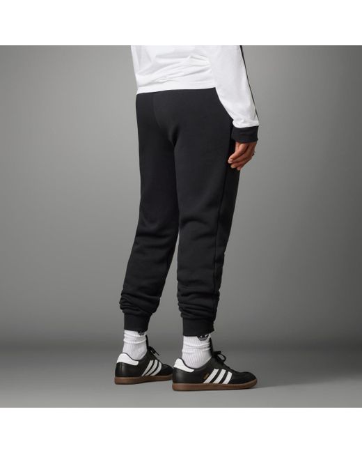 Adidas Black Manchester United Essentials Trefoil Tracksuit Bottoms for men