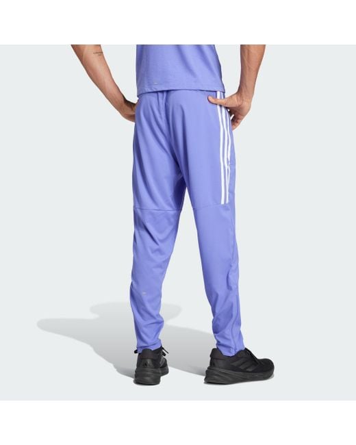 Pantaloni Own The Run 3-Stripes di Adidas in Blue da Uomo