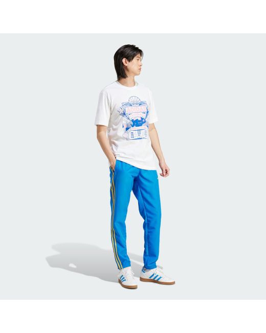 Adidas Originals Blue Woven Track Pants for men