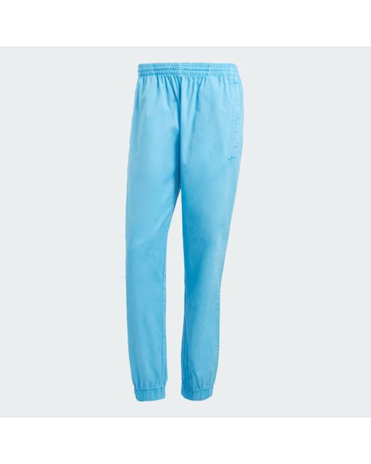 Pantaloni Trefoil Essentials+ Dye Woven di Adidas in Blue da Uomo