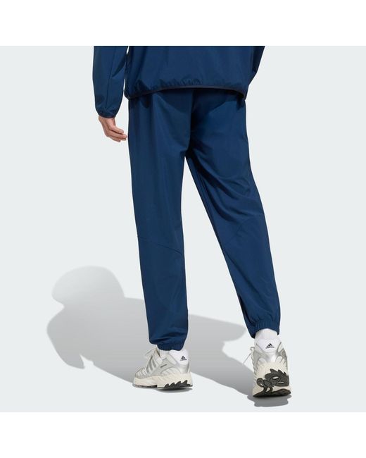 Adidas Blue Tech Trefoil Essentials Track Pant for men