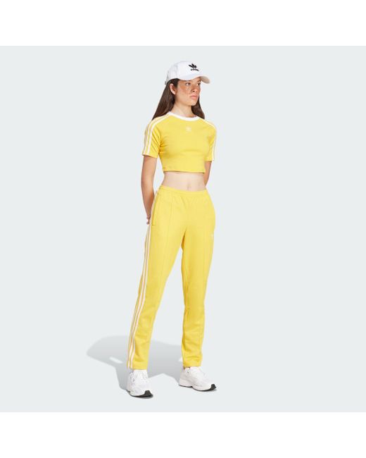Track pants Montreal di Adidas in Yellow
