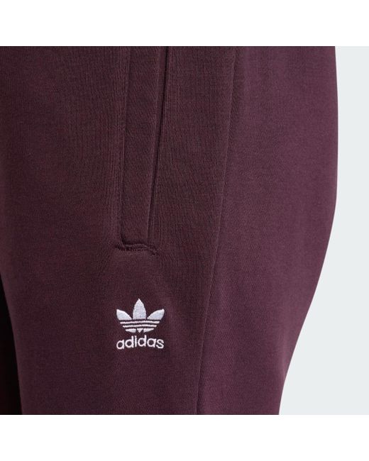 Pantaloni Adicolor Essentials Fleece Slim Joggers di Adidas in Red