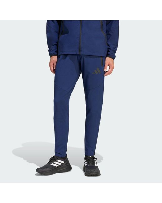 Adidas Blue Tiro Travel Woven Tracksuit Bottoms for men