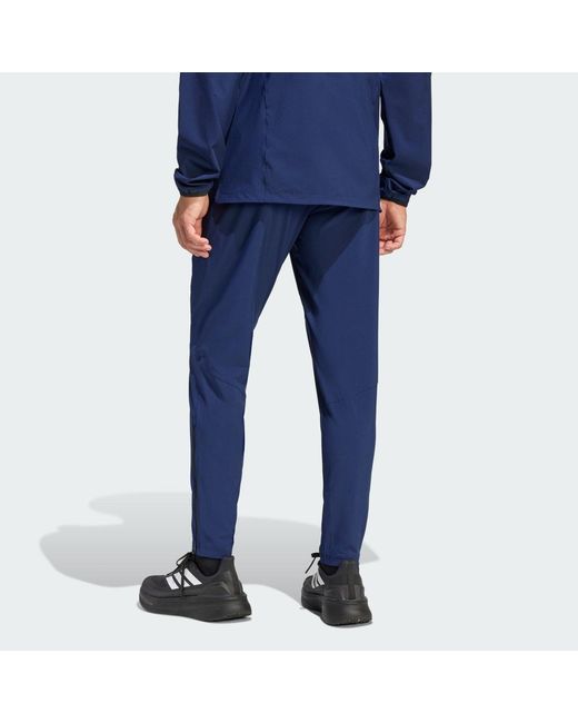 Adidas Blue Tiro Travel Woven Tracksuit Bottoms for men