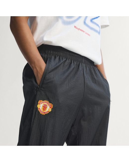 Adidas Black Manchester United Woven Pant 90 for men
