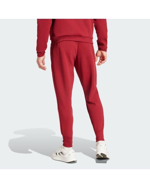 Pantaloni Travel Belgium di Adidas in Red da Uomo