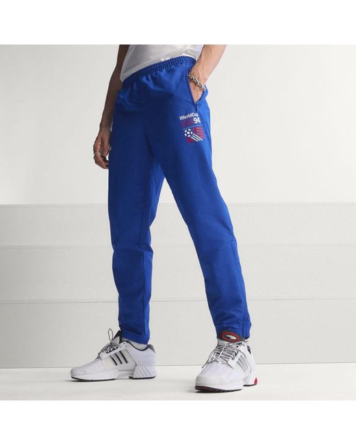 Adidas Blue Graphic Woven Track Pants for men