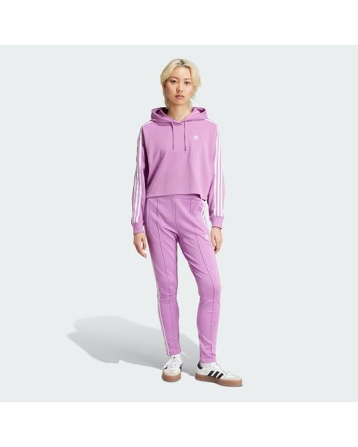 Adicolor 3-Stripes Short Hoodie di Adidas in Purple