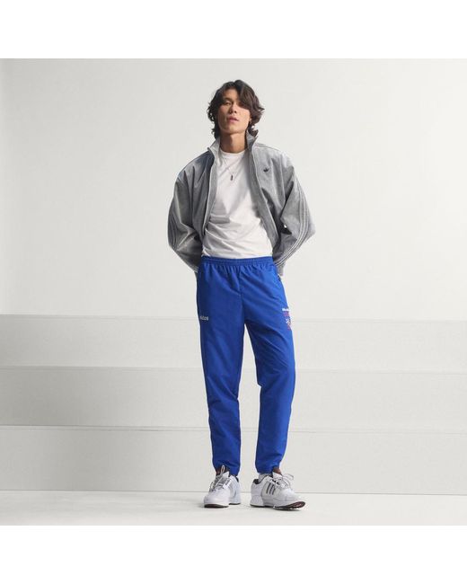 Adidas Blue Graphic Woven Track Pants for men