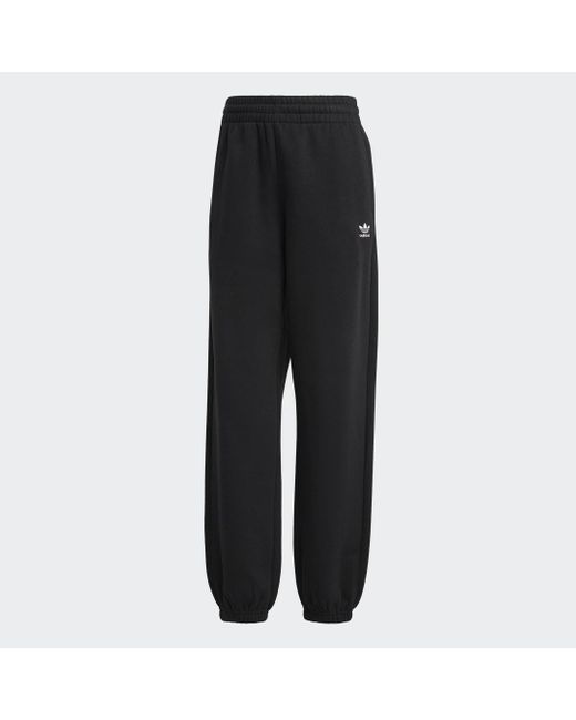 Pantaloni Essentials Fleece di Adidas in Black