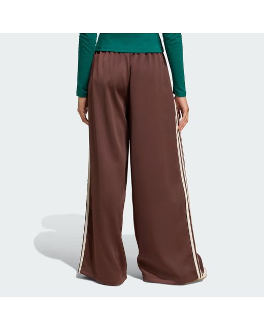 Track Pants Adicolor Satin Wide Leg di Adidas in Brown