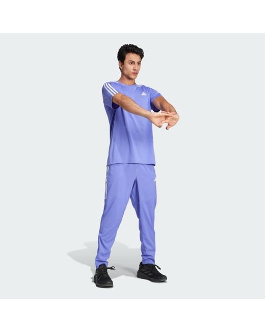 Pantaloni Own The Run 3-Stripes di Adidas in Blue da Uomo