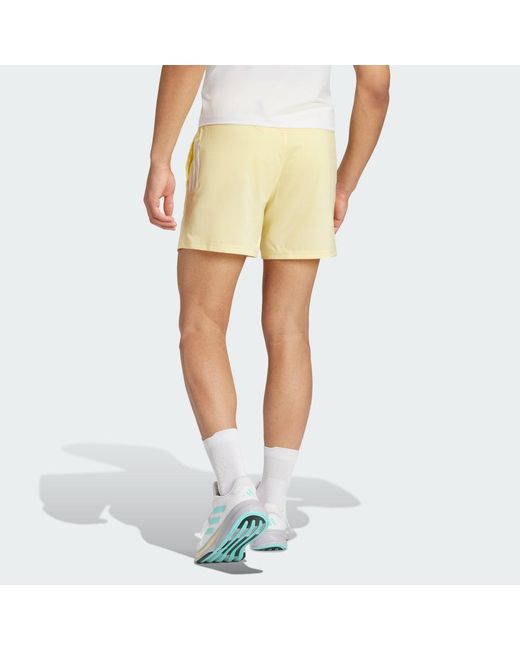 Adidas Yellow Own The Run Shorts for men