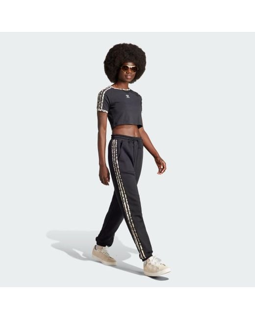Pantaloni da allenamento Originals Leopard Luxe di Adidas in Black