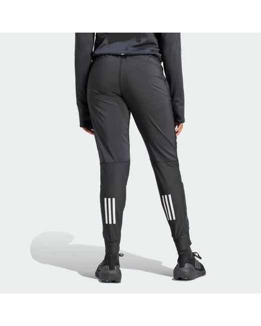 Pantaloni Own the Run di Adidas Originals in Gray