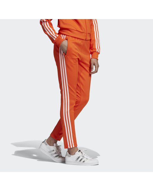 Snoep Pluche pop subtiel adidas Sst Trainingsbroek in het Oranje | Lyst NL