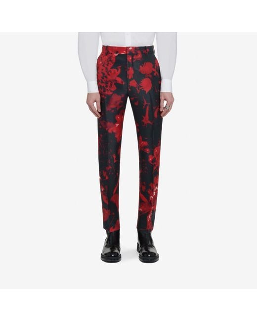 Pantaloni a sigaretta con stampa wax flower di Alexander McQueen in Red da Uomo