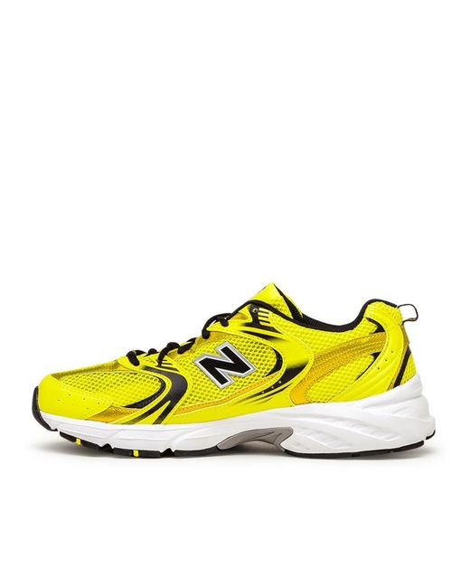 new balance 530 trainers in off white and yellow