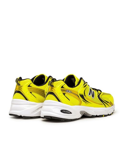 new balance 530 trainers in off white and yellow