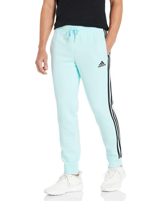 adidas Essentials Fleece Tapered Cuff 3-stripes Pants in Blue for Men | Lyst