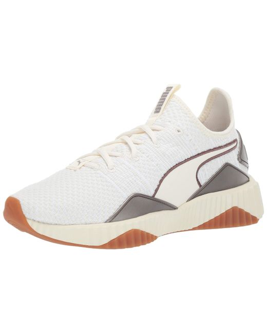 puma defy sneakers in white