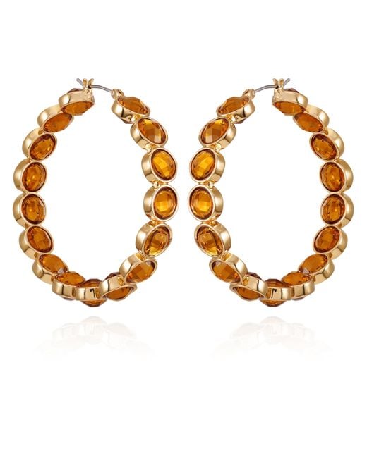 Orecchini a cerchio in vetro di cristallo arancione chiaro di Guess in Metallic