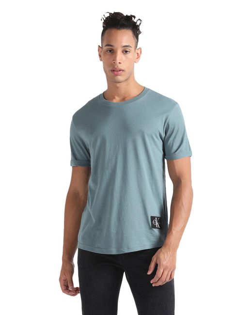 Jeans Badge Turn UP Sleeve J30J323482 di Calvin Klein in Blue da Uomo