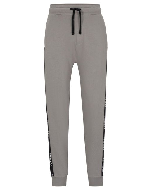 HUGO Jogginghose aus Bio-Baumwolle mit Beinbündchen und Logo-Tape in Gray für Herren
