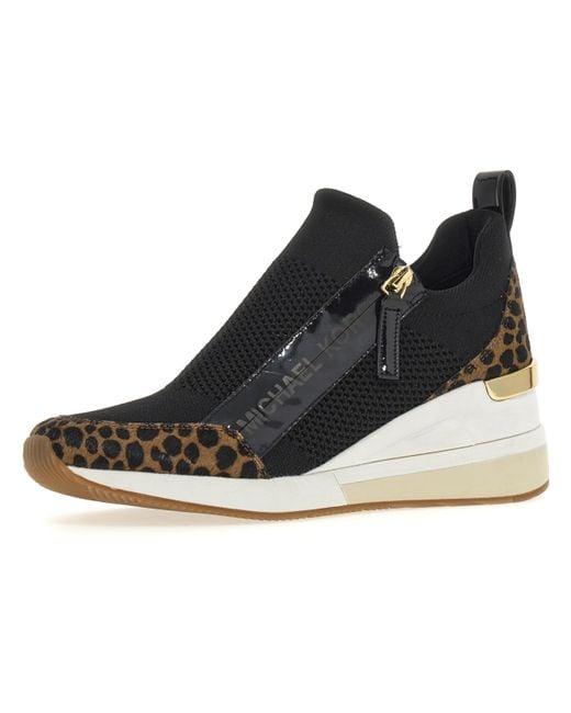 Willis Wedge Trainer di Michael Kors in Black