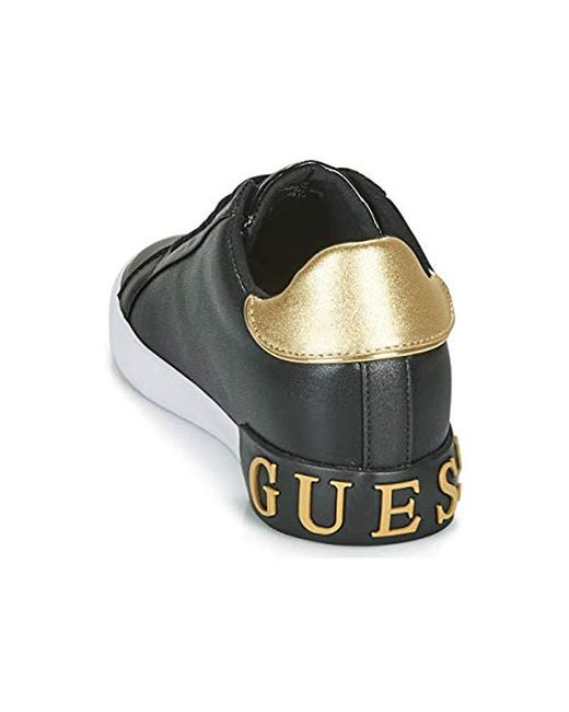 guess black and gold trainers