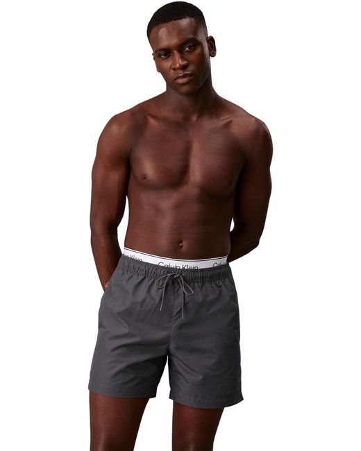 Black calvin klein swim shorts sales